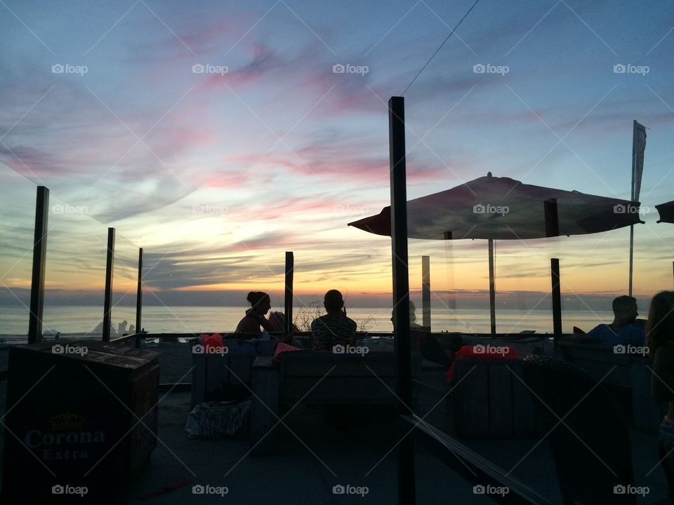 Romantic dinner at sunset at the beach