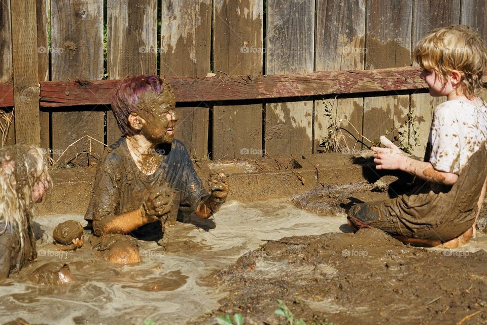 Boys Playing In Mud