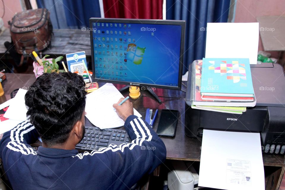 a boy studying desktop
