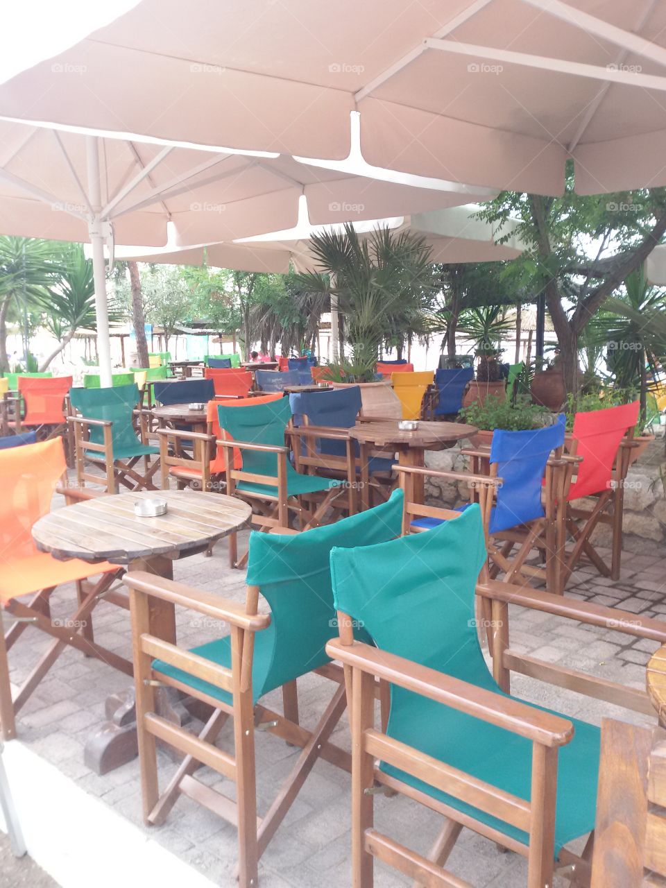 Tables and chairs on the beach