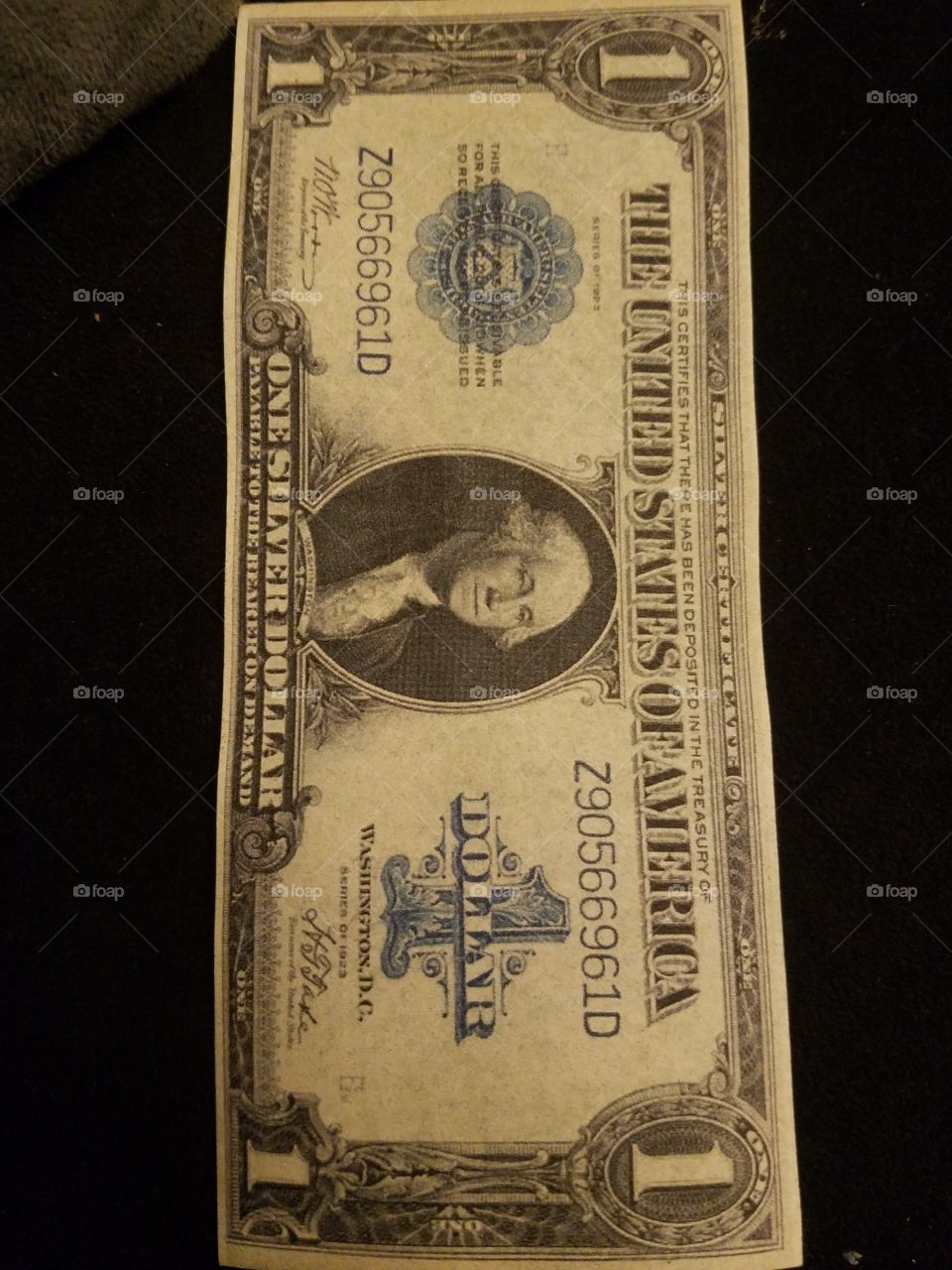 The single most common large size piece of United States currency is the 1923 $1 silver certificate.  These were issued by the millions.  Today a nice looking example can be purchased for around $20.  George Washington is shown at the center of each