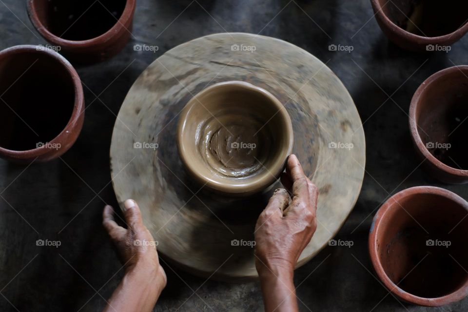 Pottery craftswomen's hands