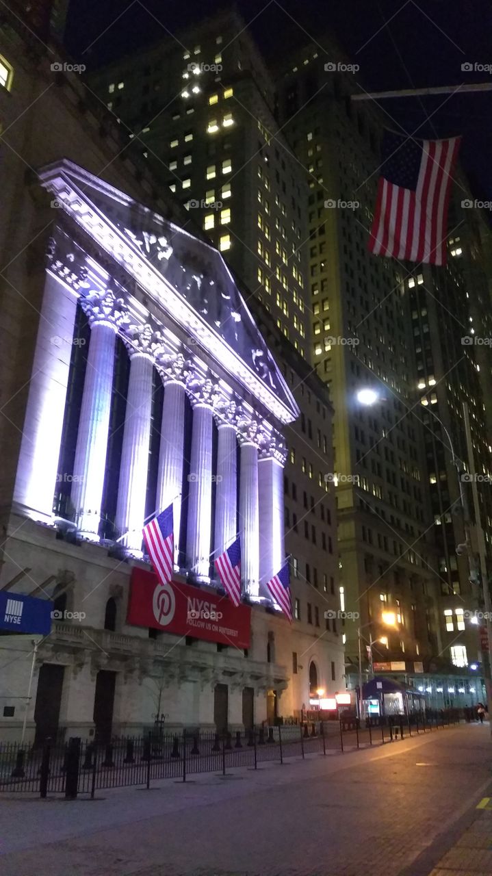 Money glows! NYSE in the evening. New York, NY.
