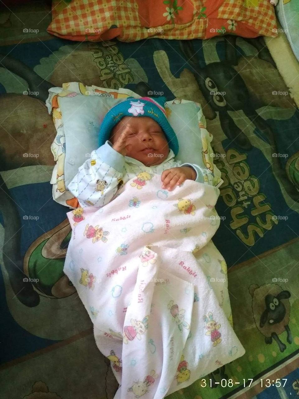 baby asleep while saluting