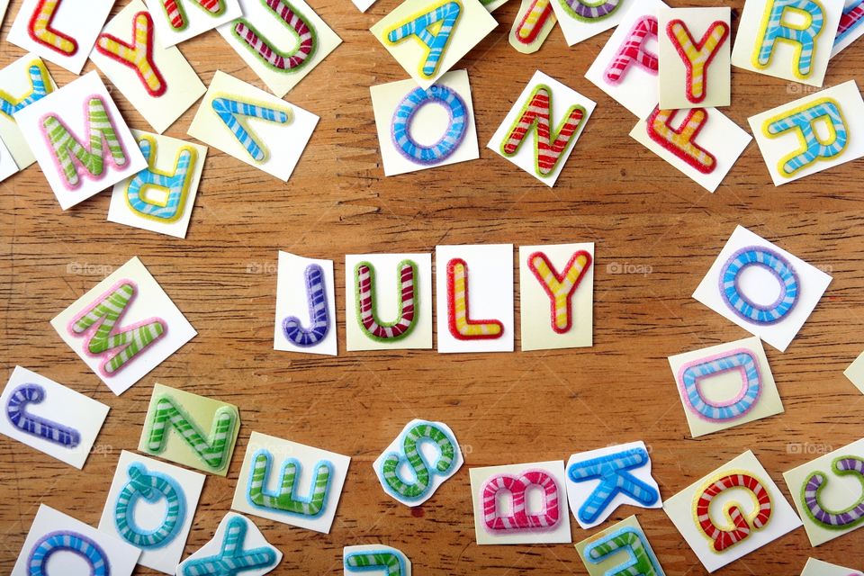 the word july. the word july spelled in colorful letters