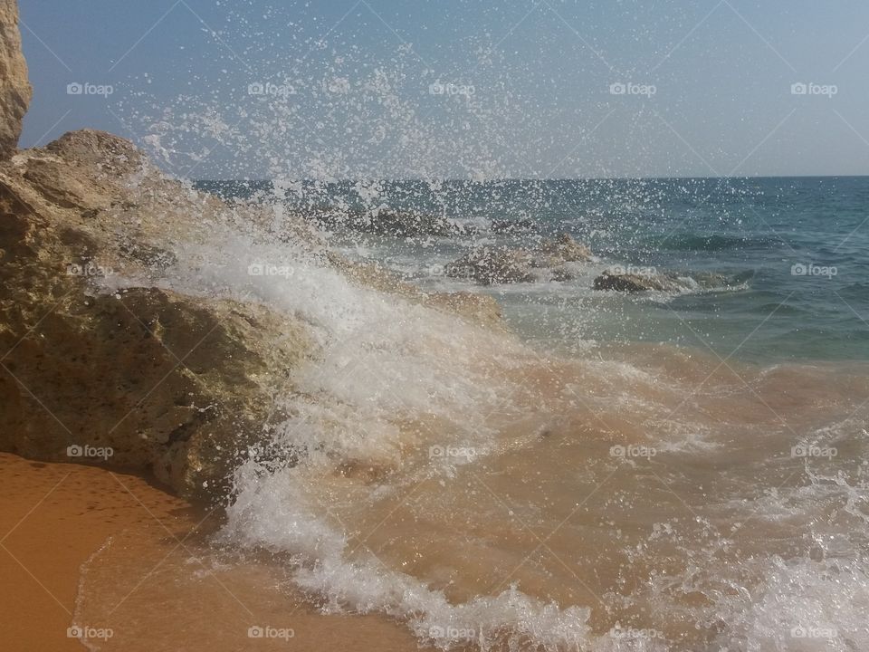 Wave crashing on the Rocks