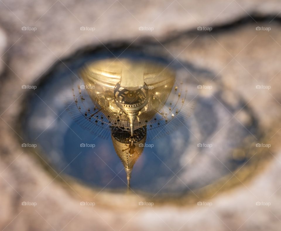 Bagan/Myanmar-Unseen shot of The most famous Pagoda in Bagan , Shwezigon Pagoda reflect in the small puddle that tourist should not forget to visit