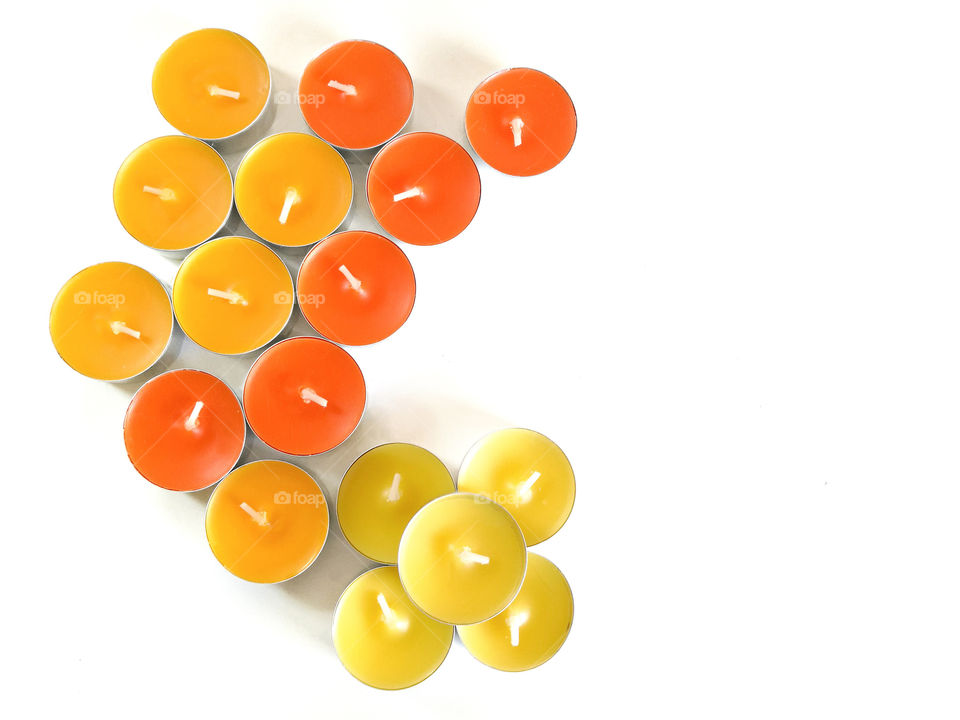 Tealight candles on white background.