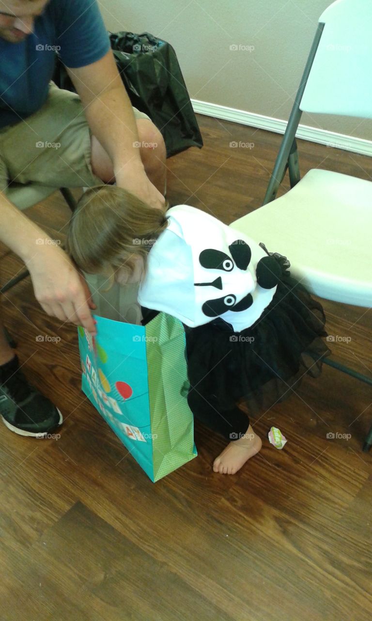our little panda digging into her presents