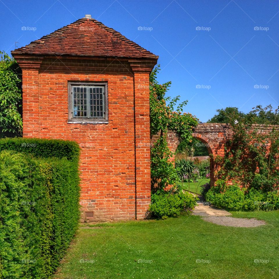 Formal gardens of Packwood House stately home - Warwickshire, England UK. 