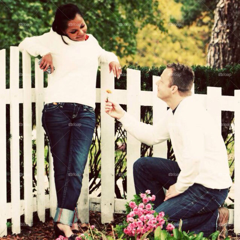 Young love. Proposal in garden