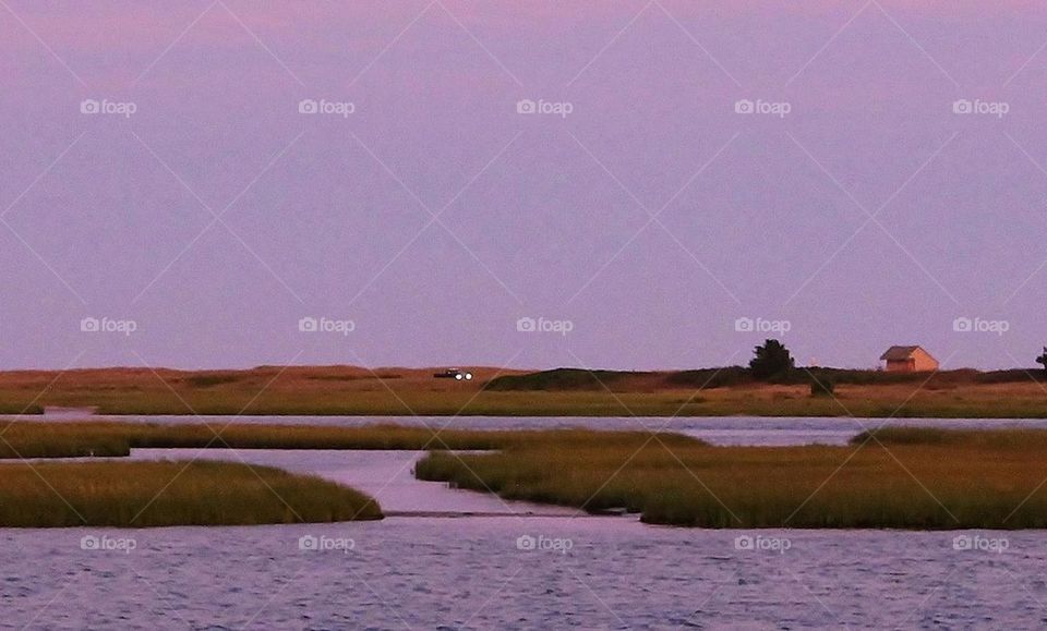 Headlights . The beach across the river