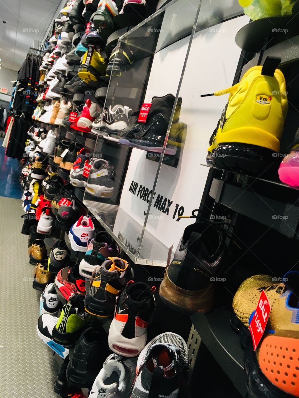 Footlocker store with wall of sneakers 
