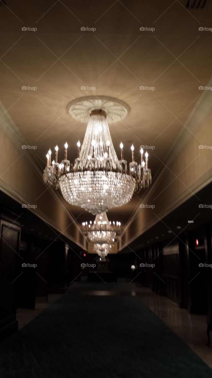 chandelier hallway. hallway of a hotel