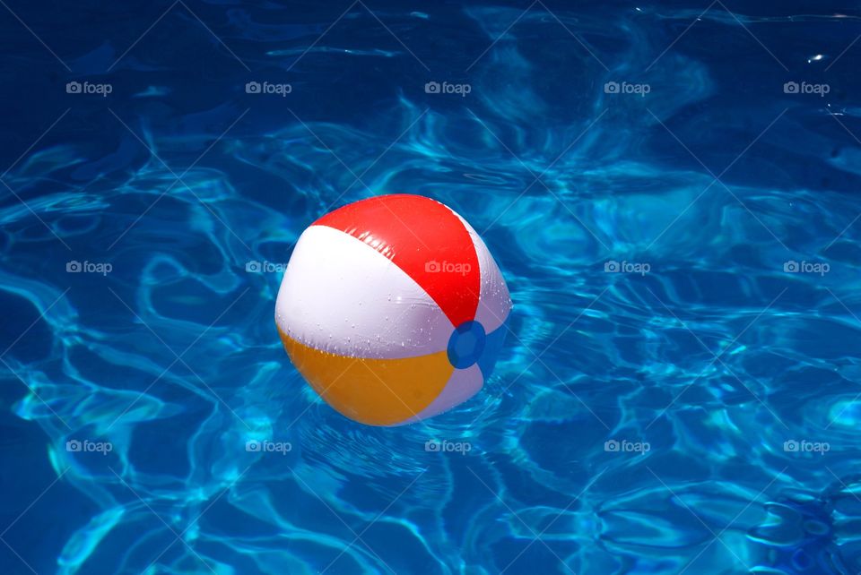 Beach ball floating on water