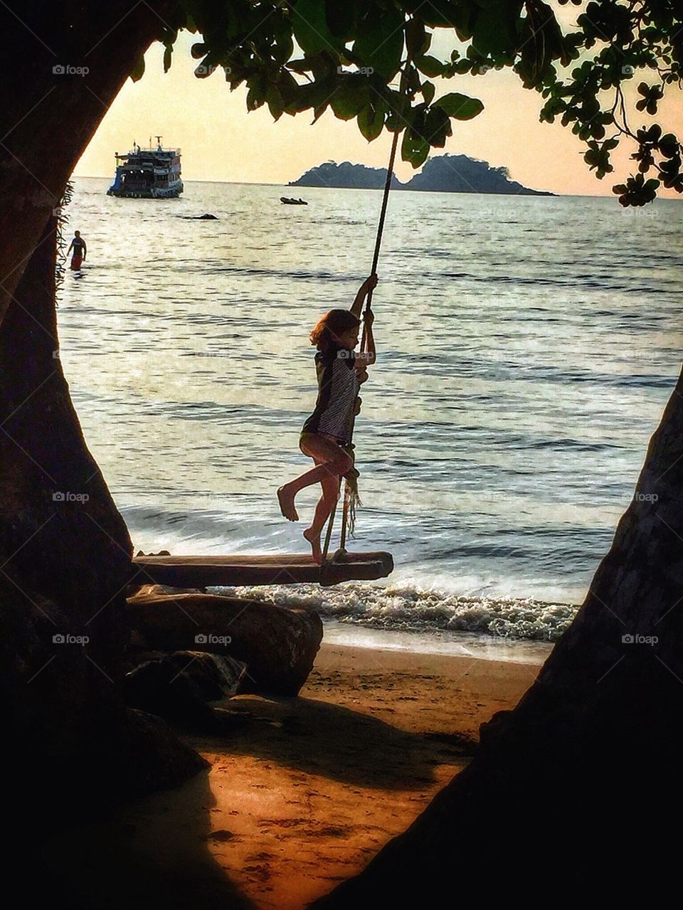 Swing by the beach. Girl swinging on the beach