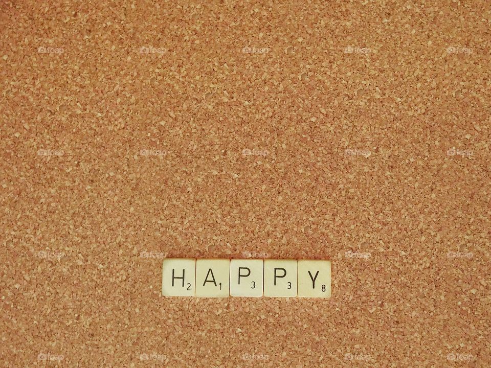 scrabble words on cork board