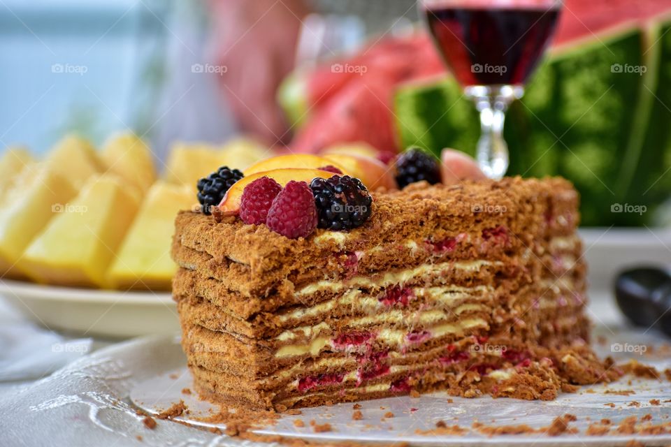 summer cake with fruit and berries on the table