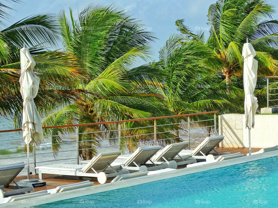 Cancún Luxury Beach Resort. Poolside At A Luxury Beach Resort In Mexico's Yucatán On The Caribbean Coast
