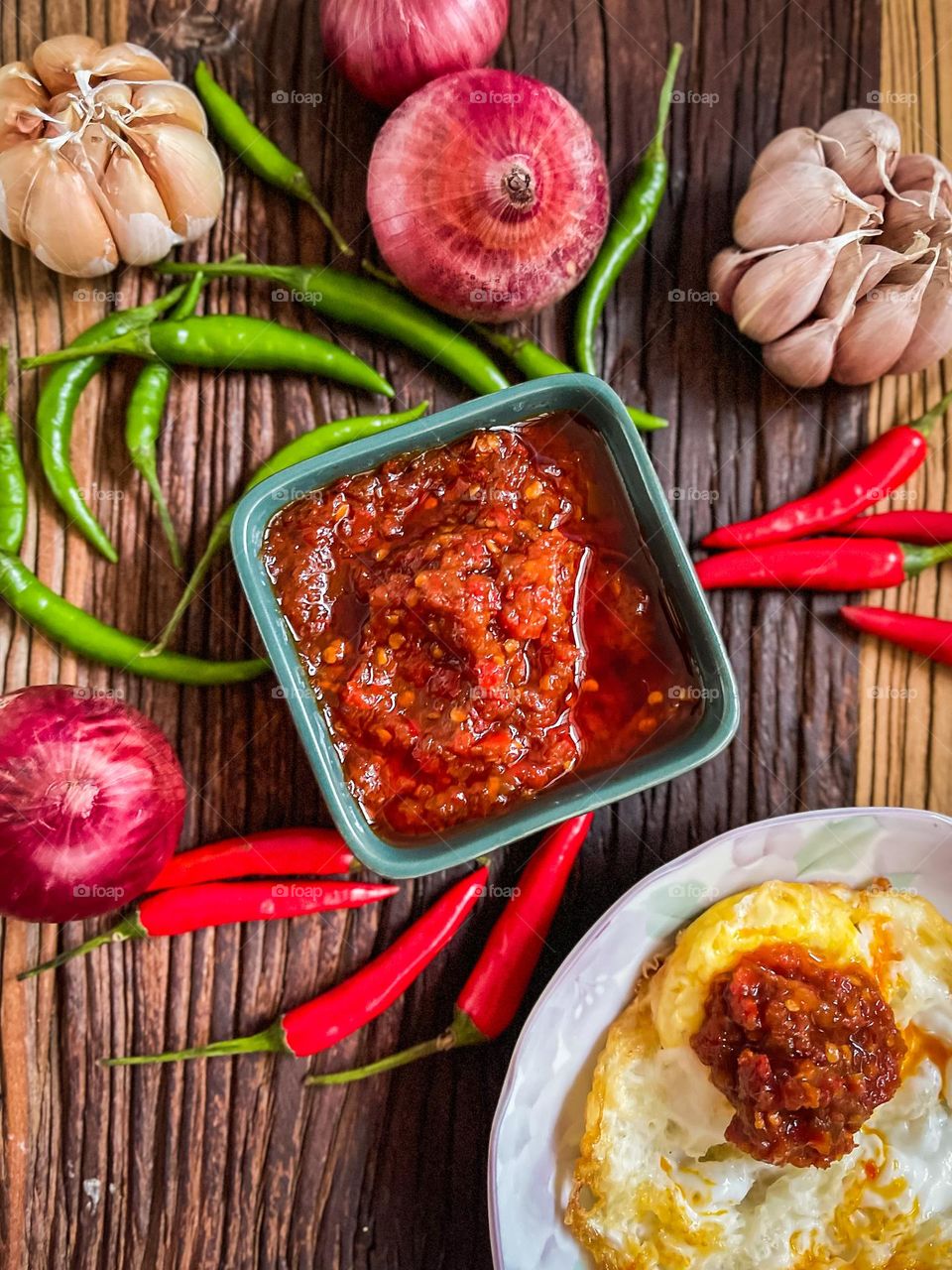 Rectangular shape of a ceramic bowl with spicy sambal inside it
