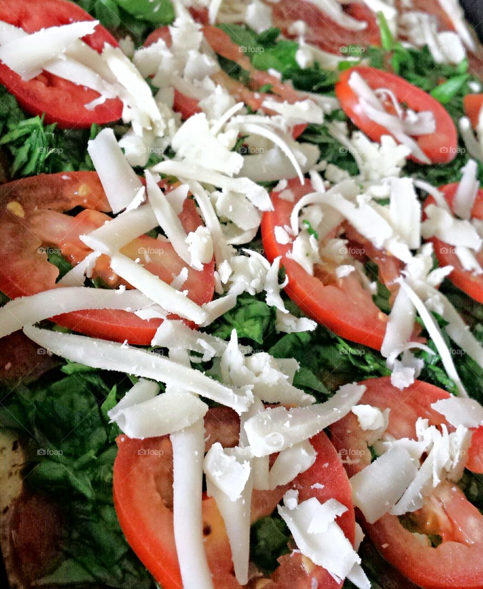 Closeup of pizza / Closeup of salad