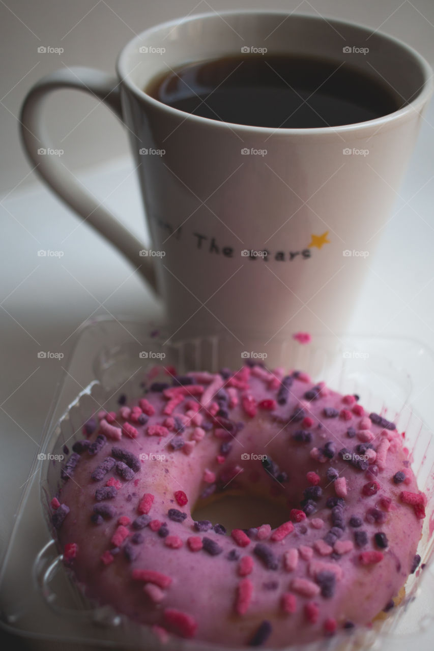 cup of coffee and doughnut