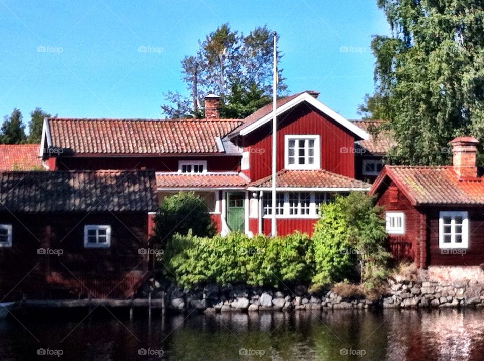 Swedish village with red wooden buildings.