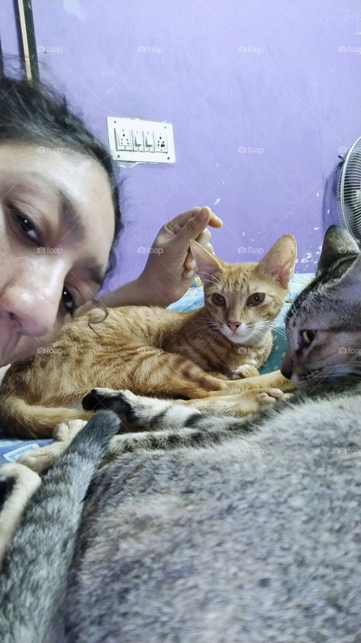 Kathi and oomar both are sitting at bed