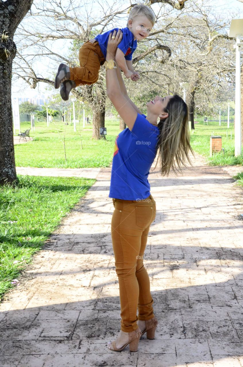 happy mother and son playing in the park