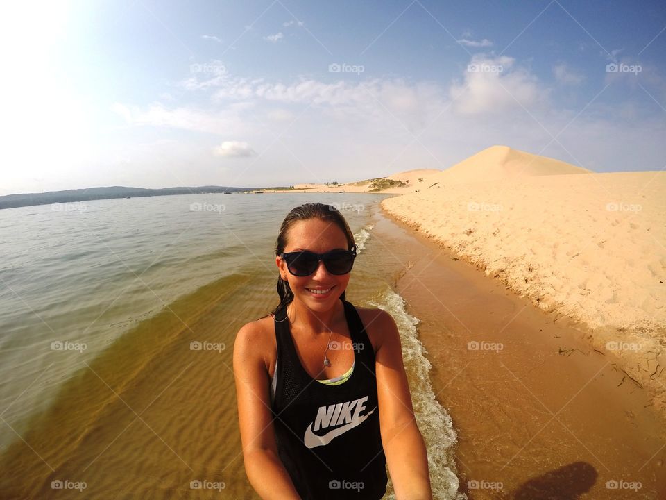 Portrait of a happy woman at beach