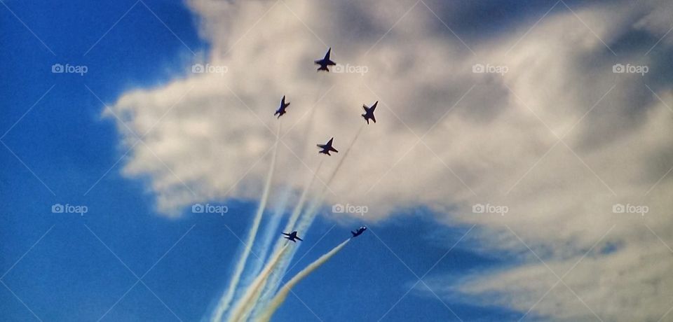 Fighter plane performing airshow in sky