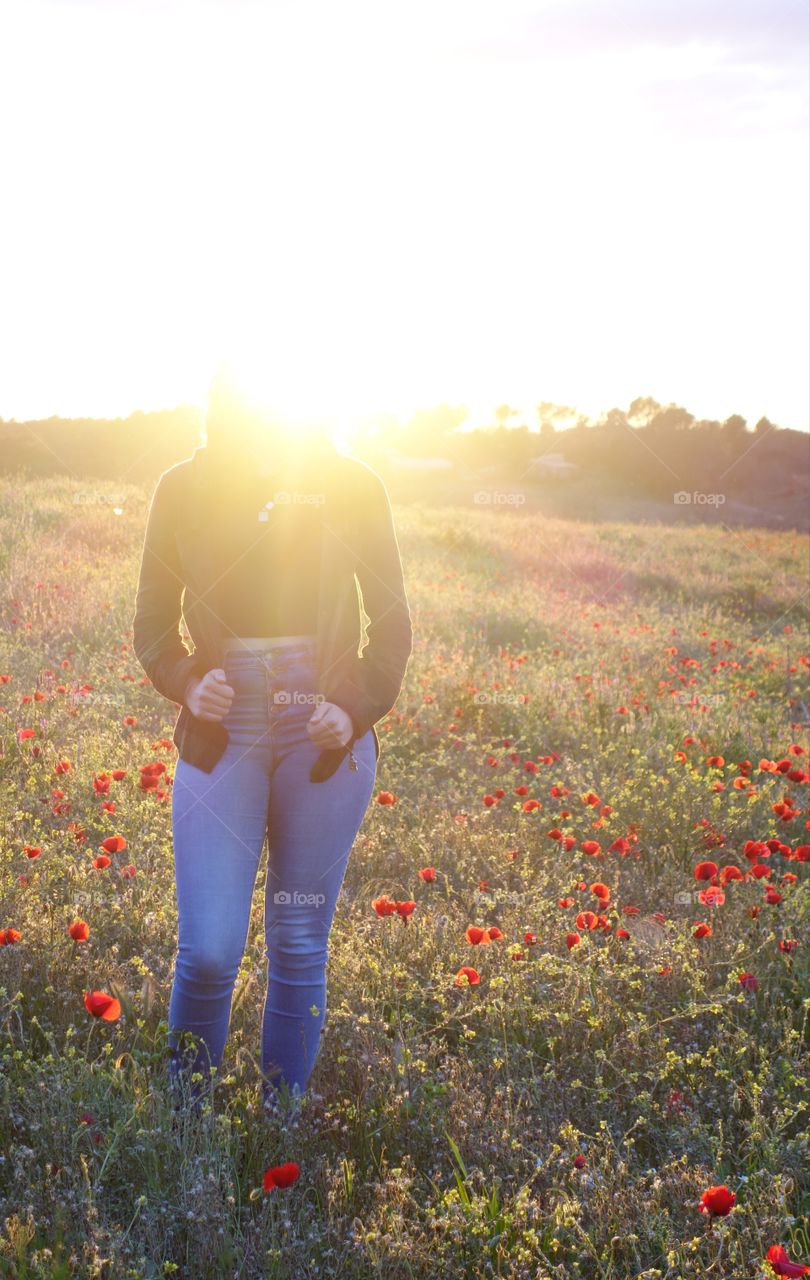 Shining girl in the poppies