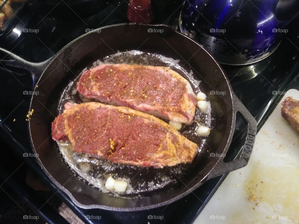 preparing steak for dinner