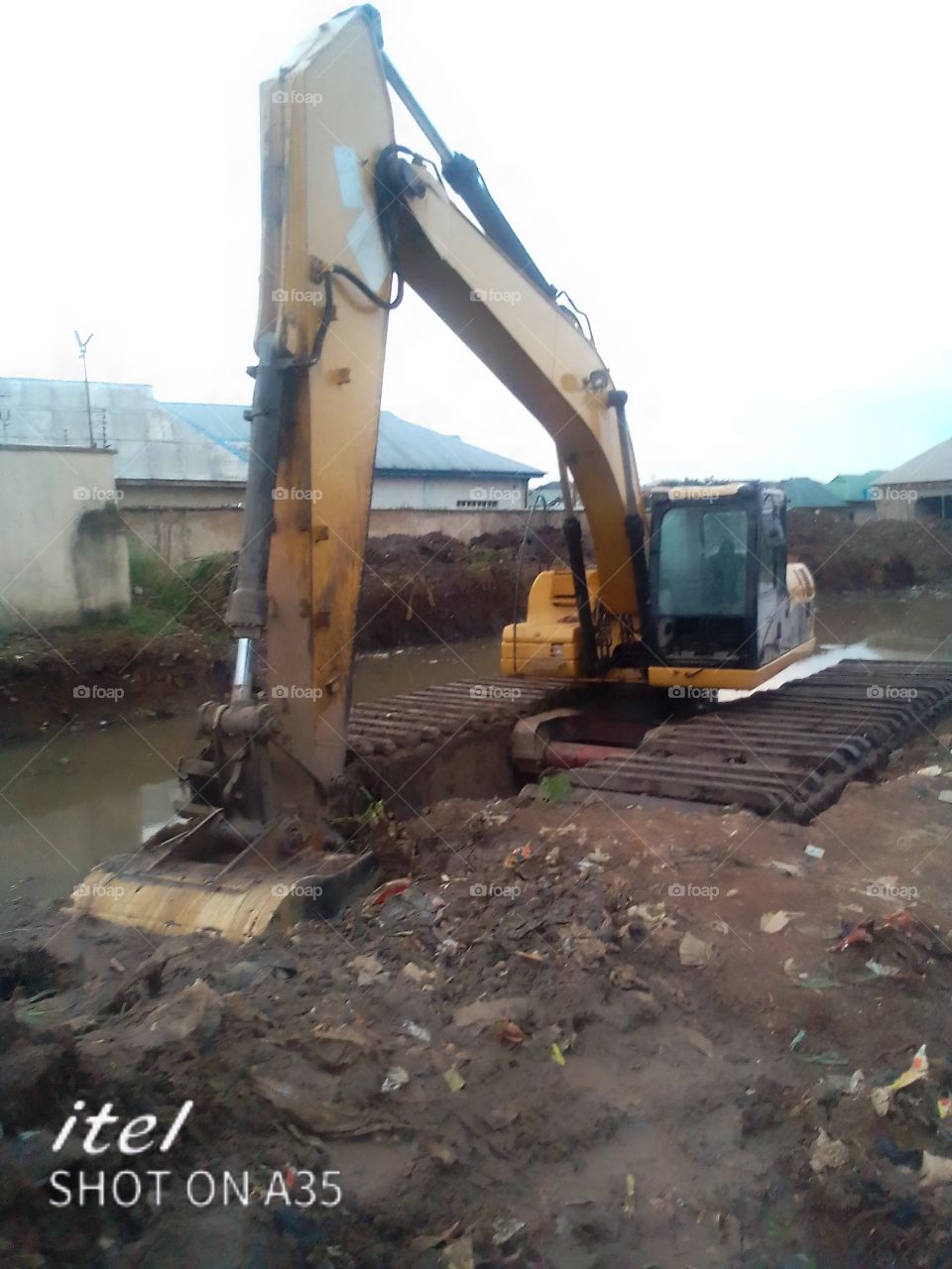 tractor digging trainage