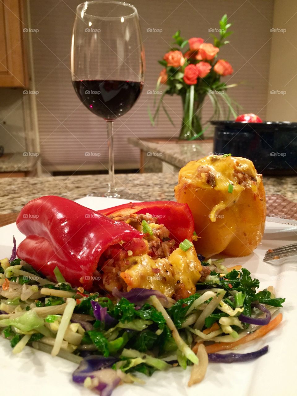 Homemade stuffed Peppers on topped of sautéed vegetable. Food & Wine.