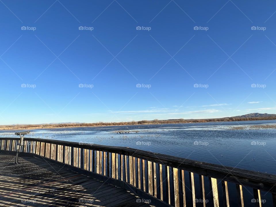 View bridge at sunset into Marsh land 