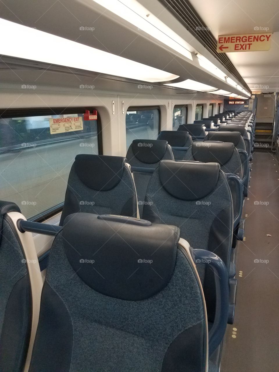 An empty car of a commuter train.
