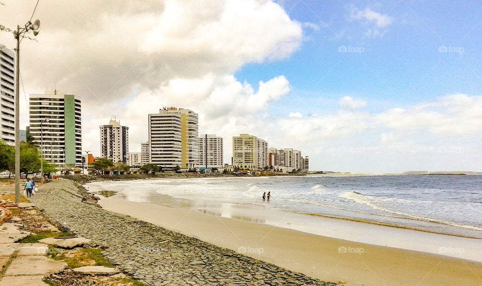 Ponta da Areia beach, seashore, builds.