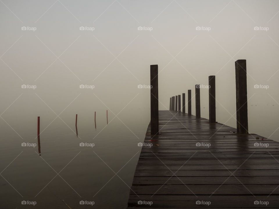 Scenic view of pier on foggy day