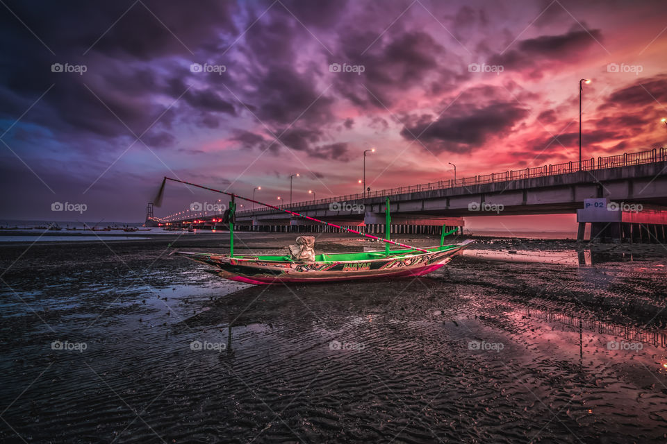 scenic view of sunrise around suramadu bridge