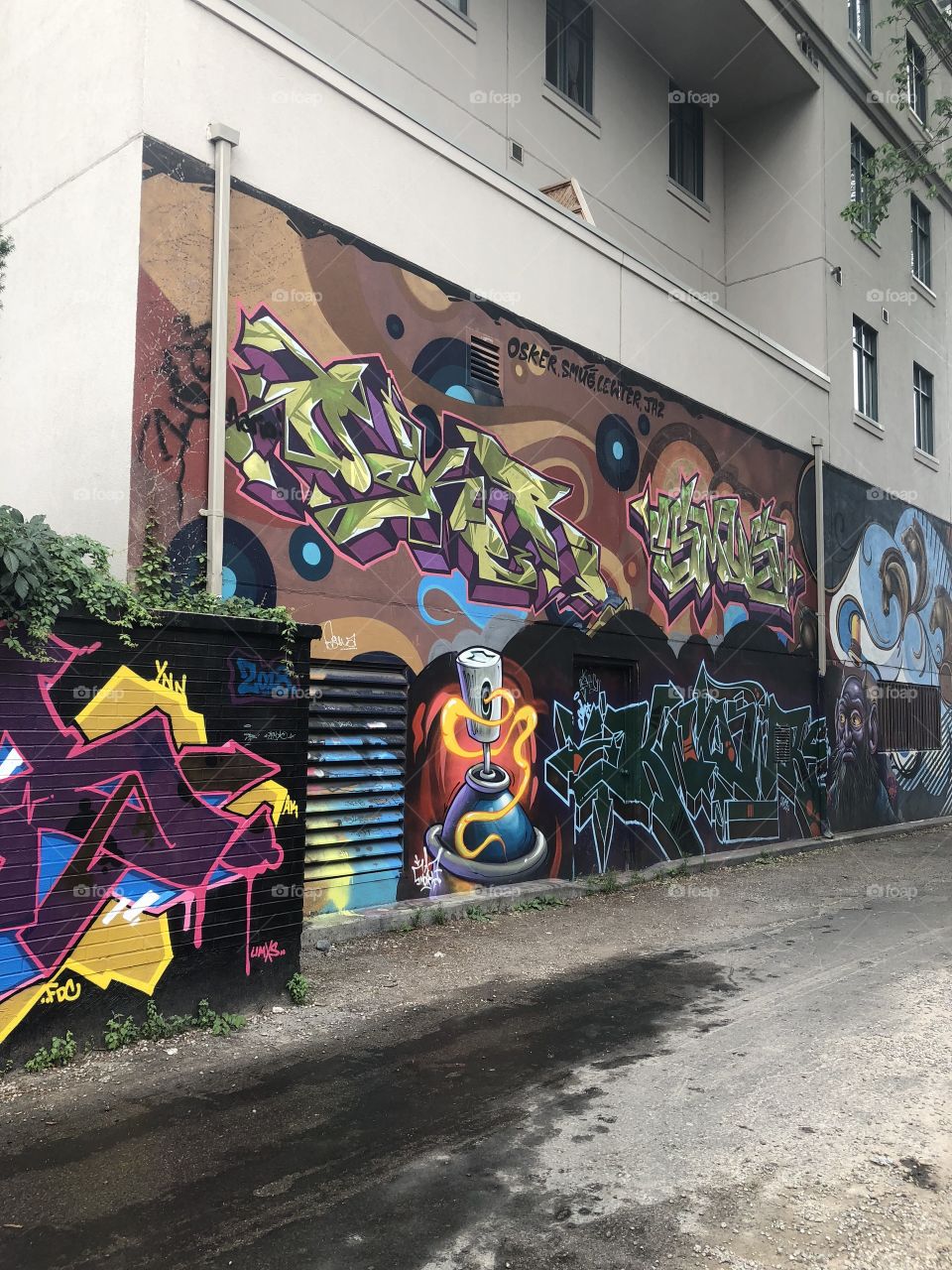Graffiti alley in Toronto, Canada, a street with many colorful graphics on the walls