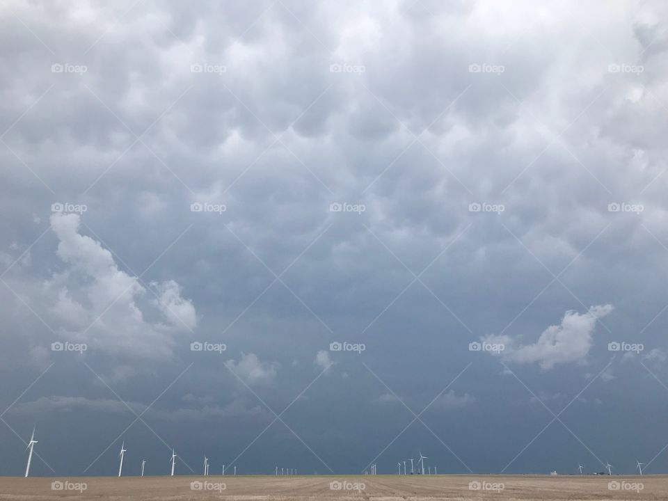 Windmills and storm clouds