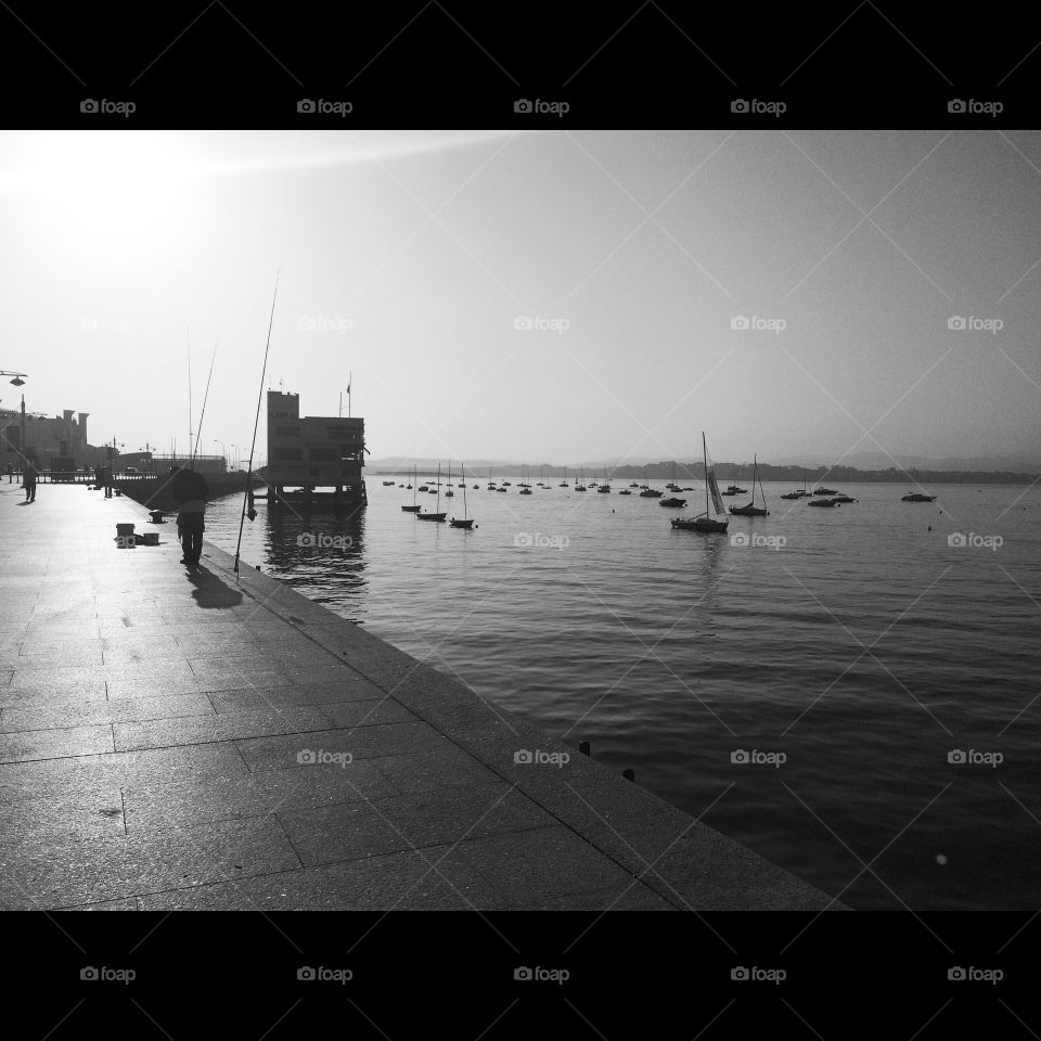 Early morning fishing. Fishermen early morning fishing in Santander, Cantabria, Spain