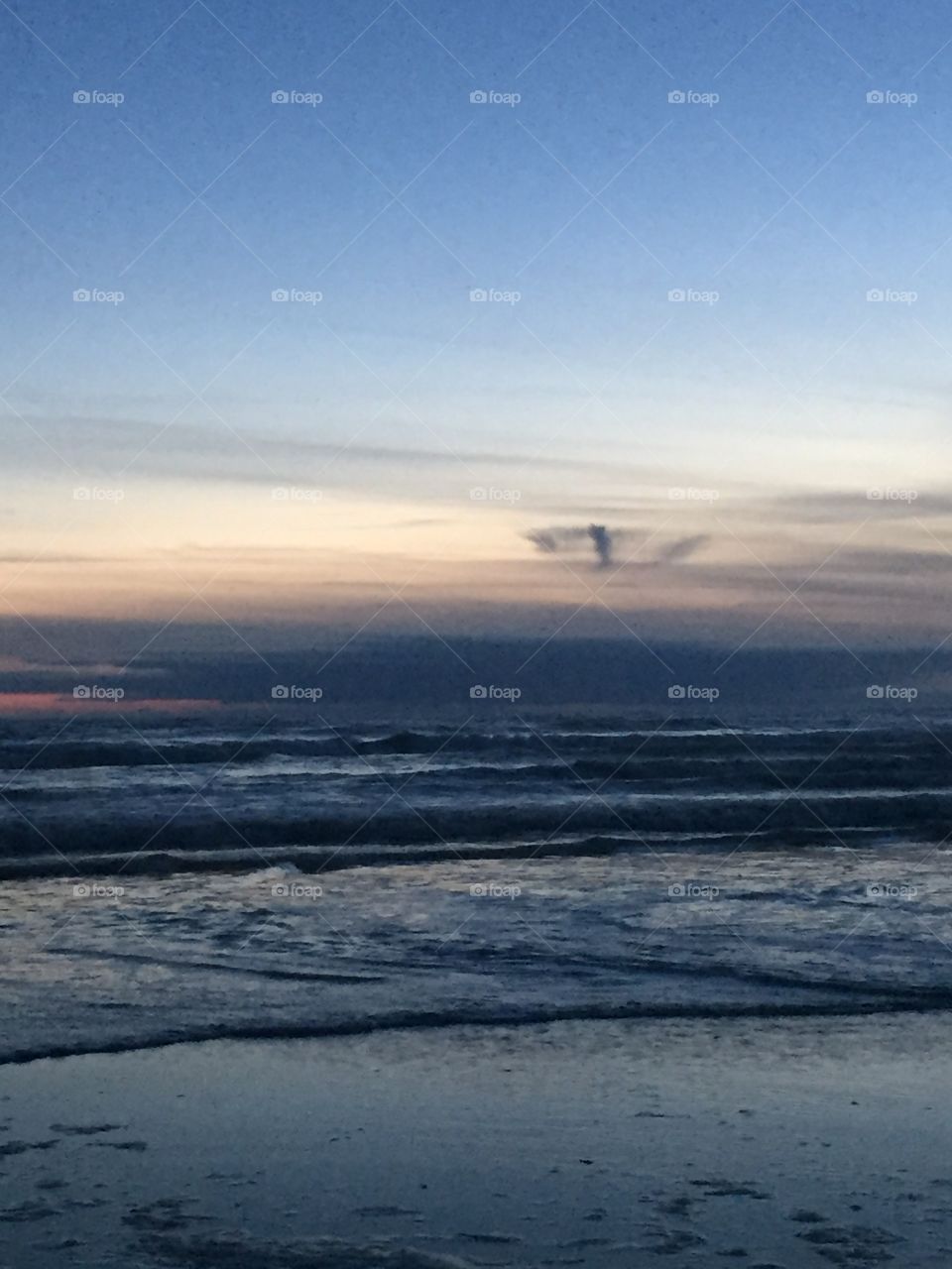 Ocean waves at sunset.