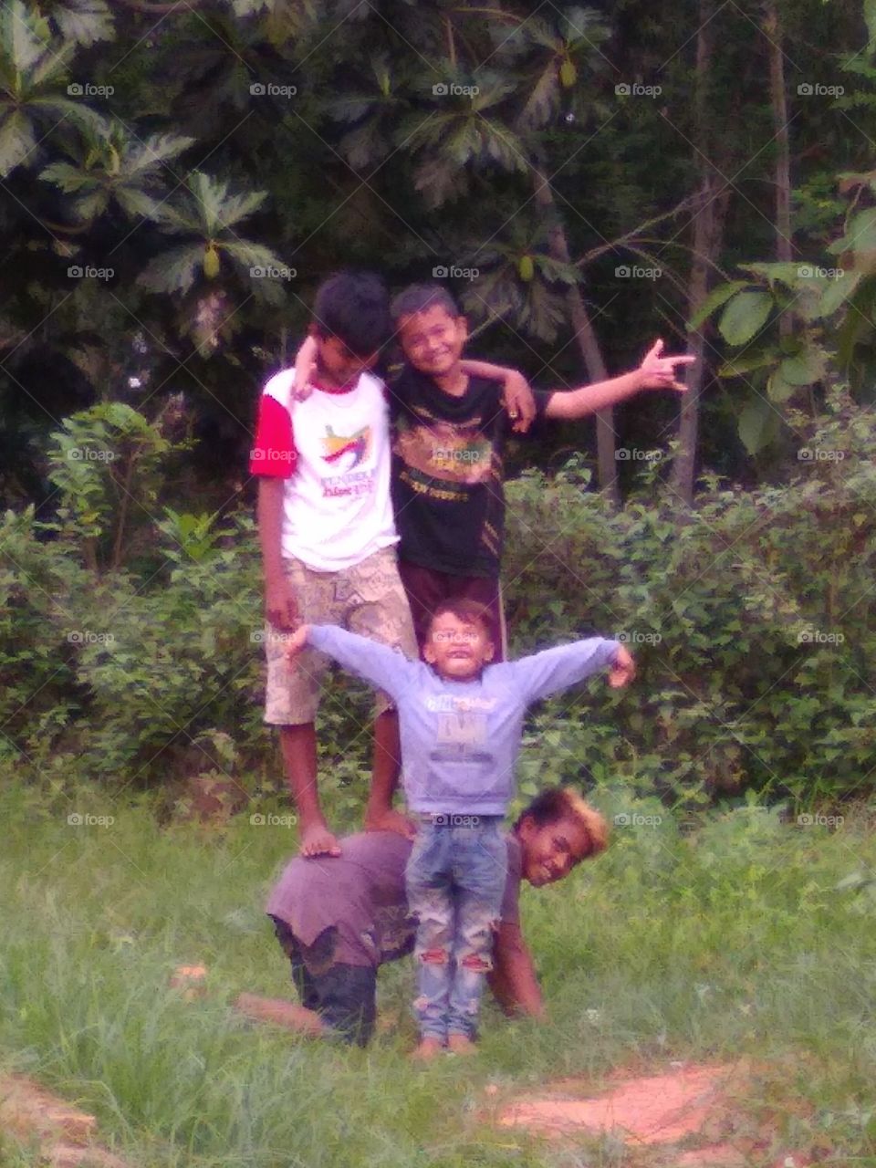 The village boy is happy to play happily