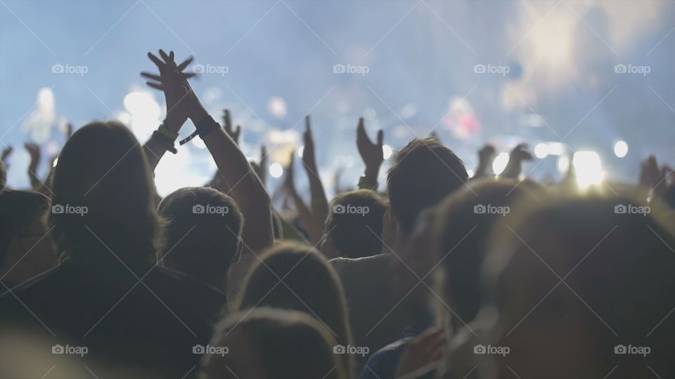 Hands of fans at a concert