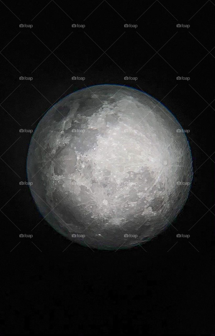 Gazing through a telescope at a full moon on a summer night, Southern Hemisphere, New Zealand 