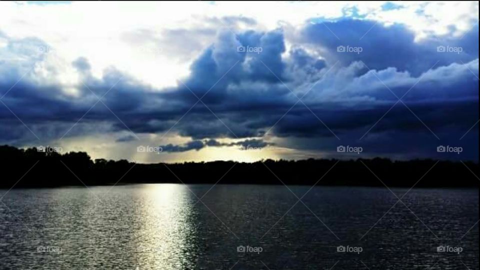 Scenic view of cloudy sky over calm sea