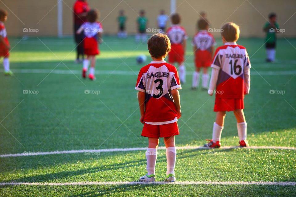 Young kids soccer game in action