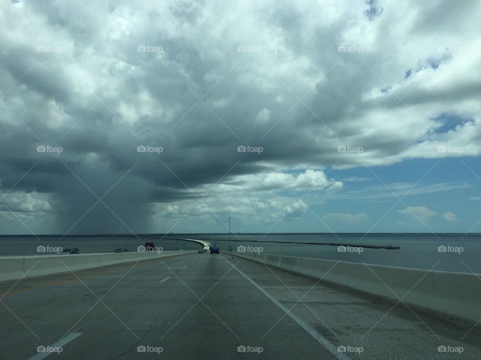 Summer storm. Summer storm seen from a bridge over the ocean.